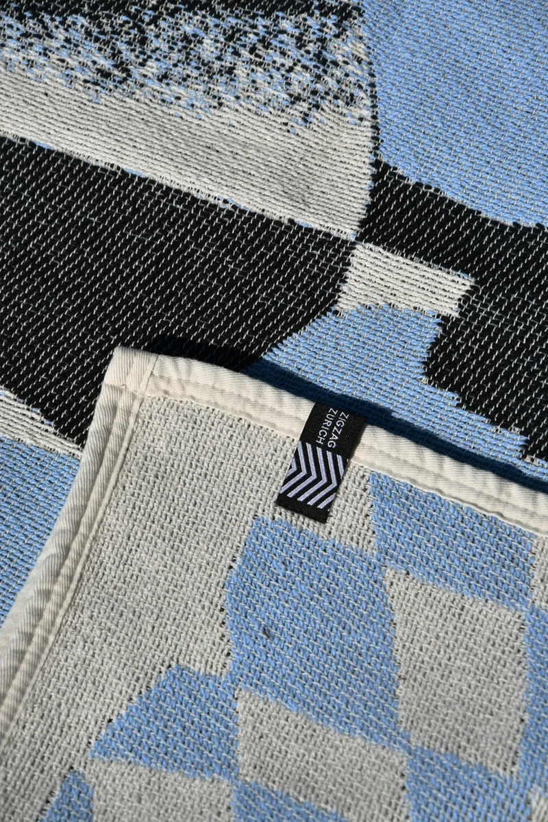 Cotton Beach Towel / Mini Blanket “Cosmic Man” by Raphael Greaves